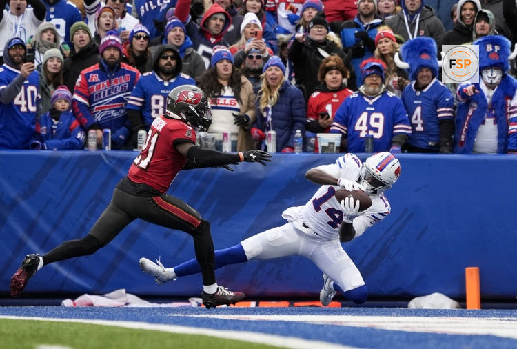 Nov 16, 2025; Orchard Park, New York, USA;  Buffalo Bills wide receiver Tyrell Shavers (14) makes a touchdown catch against Tampa Bay Buccaneers cornerback Benjamin Morrison (21) during the first half of the game at Highmark Stadium. Credit: Gregory Fisher-Imagn Images