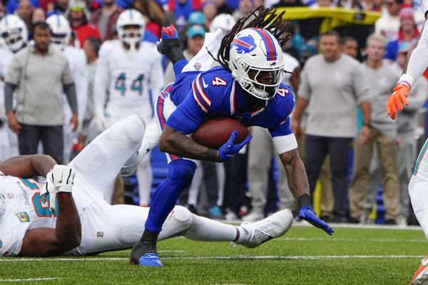 Nov 3, 2024; Orchard Park, New York, USA; Buffalo Bills running back James Cook (4) runs with the ball against the Miami Dolphins during the second half at Highmark Stadium. Mandatory Credit: Gregory Fisher-Imagn Images