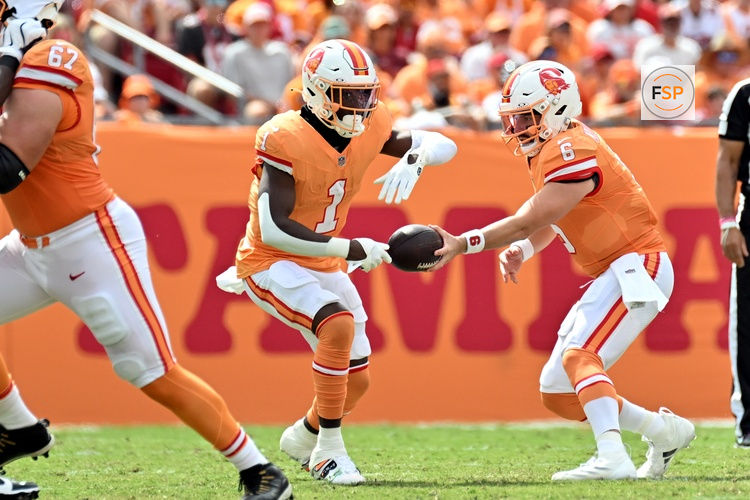 Oct 27, 2024; Tampa, Florida, USA; Tampa Bay Buccaneers quarterback Baker Mayfield (6) hands off to  running back Rachaad White (1)in the first half against the Atlanta Falcons at Raymond James Stadium. Credit: Jonathan Dyer-Imagn Images