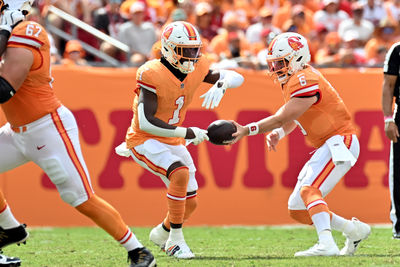 Oct 27, 2024; Tampa, Florida, USA; Tampa Bay Buccaneers quarterback Baker Mayfield (6) hands off to  running back Rachaad White (1)in the first half against the Atlanta Falcons at Raymond James Stadium. Mandatory Credit: Jonathan Dyer-Imagn Images