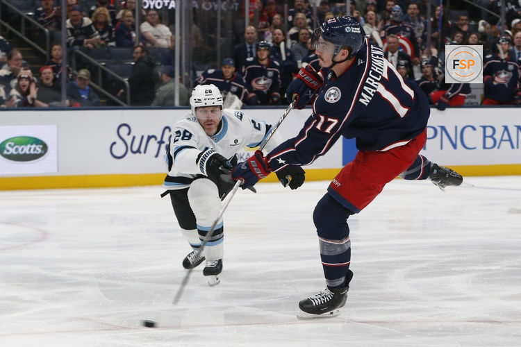 Mar 7, 2026; Columbus, Ohio, USA; Columbus Blue Jackets left wing Mason Marchment (17) wrists a shot on goal as Utah Mammoth defenseman Ian Cole (28) defends during the second period at Nationwide Arena. Credit: Russell LaBounty-Imagn Images