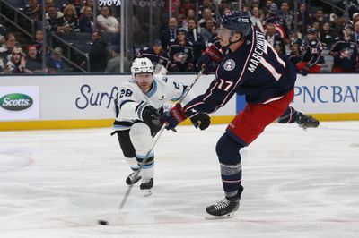 Mar 7, 2026; Columbus, Ohio, USA; Columbus Blue Jackets left wing Mason Marchment (17) wrists a shot on goal as Utah Mammoth defenseman Ian Cole (28) defends during the second period at Nationwide Arena. Mandatory Credit: Russell LaBounty-Imagn Images