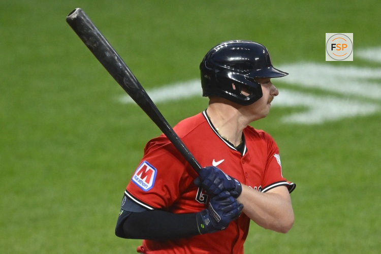 Jul 30, 2025; Cleveland, Ohio, USA; Cleveland Guardians first baseman Kyle Manzardo (9) hits a RBI single in the eighth inning against the Colorado Rockies at Progressive Field. Credit: David Richard-Imagn Images