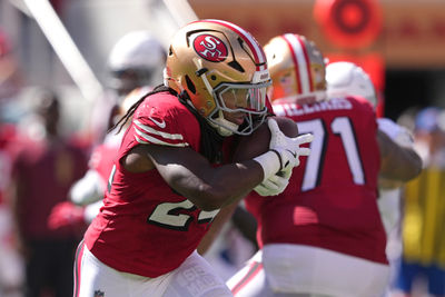 Oct 6, 2024; Santa Clara, California, USA; San Francisco 49ers running back Jordan Mason (24) carries the ball against the Arizona Cardinals during the second quarter at Levi's Stadium. Mandatory Credit: Darren Yamashita-Imagn Images