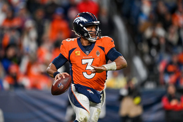 DENVER, CO - JANUARY 8: Denver Broncos quarterback Russell Wilson (3) rolls out of the pocket during a game between the Los Angeles Chargers and the Denver Broncos at Empower Field at Mile High on January 8, 2023 in Denver, Colorado. (Photo by Dustin Bradford/Icon Sportswire)