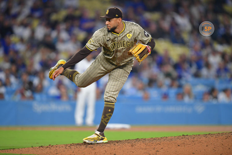 Sep 24, 2024; Los Angeles, California, USA; San Diego Padres pitcher Robert Suarez (75) throws against the Los Angeles Dodgers during the ninth inning at Dodger Stadium. Credit: Gary A. Vasquez-Imagn Images