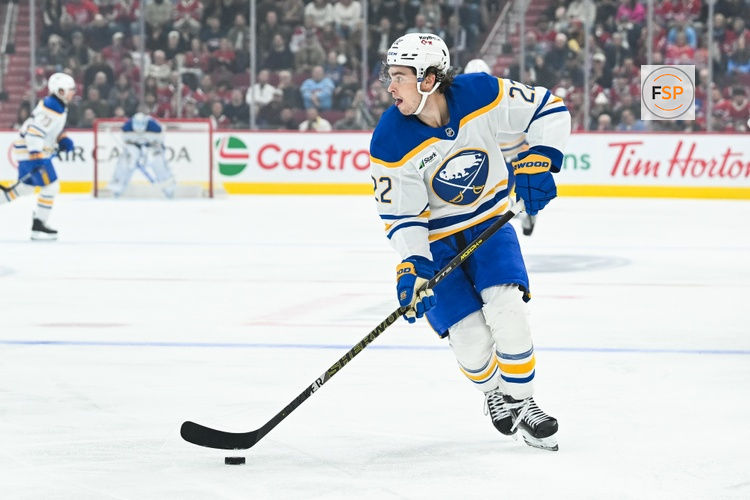 Oct 13, 2026; Montreal, Quebec, CAN; Buffalo Sabres right wing Jack Quinn (22) plays the puck against the Montreal Canadiens during the first period at Bell Centre. Credit: David Kirouac-Imagn Images