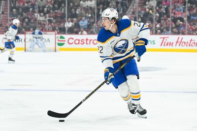 Oct 13, 2026; Montreal, Quebec, CAN; Buffalo Sabres right wing Jack Quinn (22) plays the puck against the Montreal Canadiens during the first period at Bell Centre. Mandatory Credit: David Kirouac-Imagn Images