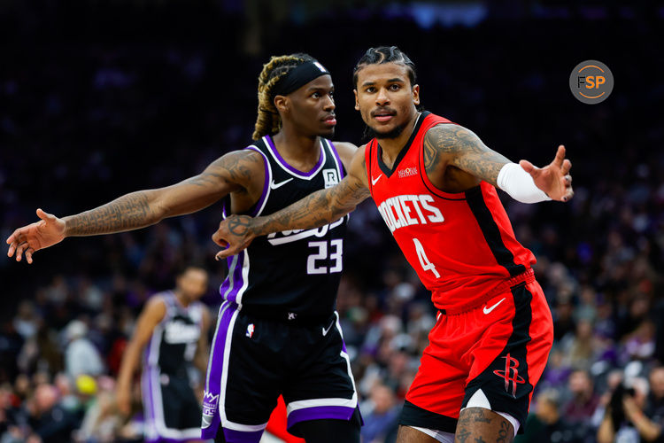 Jan 16, 2025; Sacramento, California, USA; Houston Rockets guard Jalen Green (4) is defended by Sacramento Kings guard Keon Ellis (23) during the second quarter at Golden 1 Center. Credit: Sergio Estrada-Imagn Images