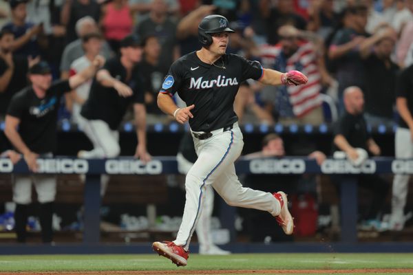 Aug 1, 2025; Miami, Florida, USA; Miami Marlins center fielder Jakob Marsee (87) scores against the New York Yankees during the ninth inning at loanDepot Park. Mandatory Credit: Sam Navarro-Imagn Images