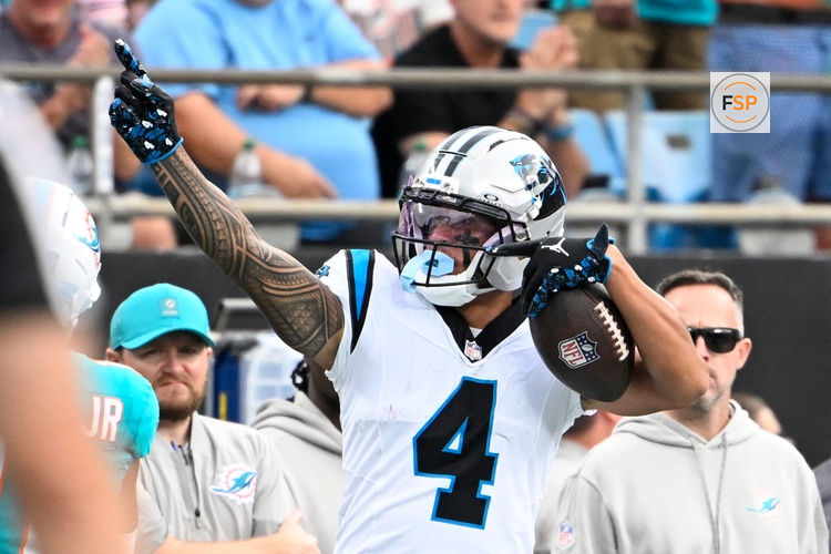 Oct 5, 2025; Charlotte, North Carolina, USA; Carolina Panthers wide receiver Tetairoa McMillan (4) signals first down in the second quarter at Bank of America Stadium. Credit: Bob Donnan-Imagn Images