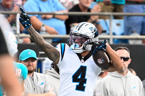 Oct 5, 2025; Charlotte, North Carolina, USA; Carolina Panthers wide receiver Tetairoa McMillan (4) signals first down in the second quarter at Bank of America Stadium. Mandatory Credit: Bob Donnan-Imagn Images