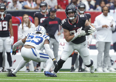 Oct 27, 2024; Houston, Texas, USA; Houston Texans tight end Dalton Schultz (86) makes a reception as Indianapolis Colts cornerback Kenny Moore II (23) defends during the second quarter at NRG Stadium. Mandatory Credit: Troy Taormina-Imagn Images