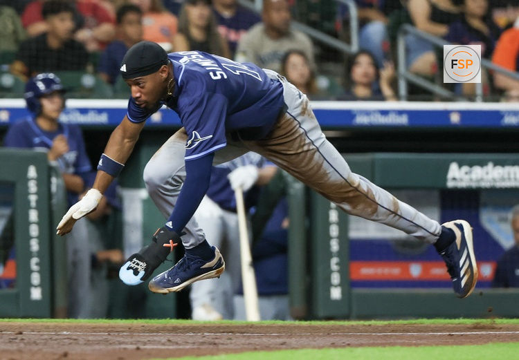 May 29, 2025; Houston, Texas, USA; Tampa Bay Rays left fielder Chandler Simpson (14) steals third base then scores a run on Houston Astros catcher Yainer Diaz (21) (not pictured) errant throw in the fourth inning at Daikin Park. Credit: Thomas Shea-Imagn Images