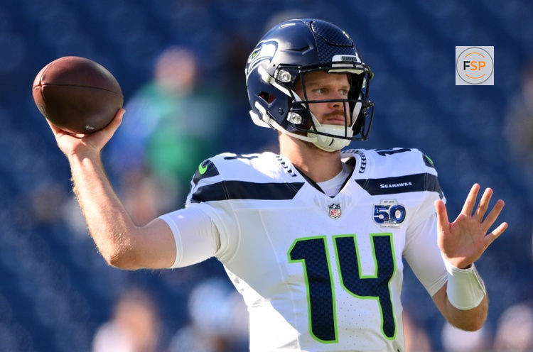 Nov 23, 2025; Nashville, Tennessee, USA;  Seattle Seahawks quarterback Sam Darnold (14) warms up before a game against the Tennessee Titans at Nissan Stadium. Credit: Steve Roberts-Imagn Images