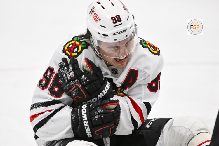 Dec 12, 2025; St. Louis, Missouri, USA; Chicago Blackhawks center Connor Bedard (98) reacts in pain after a face off against St. Louis Blues center Brayden Schenn (not pictured) during the third period at Enterprise Center. Credit: Jeff Curry-Imagn Images