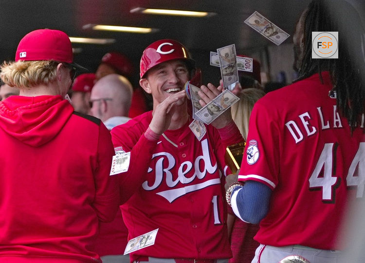 Apr 26, 2025; Denver, Colorado, USA; Cincinnati Reds outfielder Austin Hays (12) celebrates his solo home run in the sixth inning against the Colorado Rockies at Coors Field. Credit: Ron Chenoy-Imagn Images