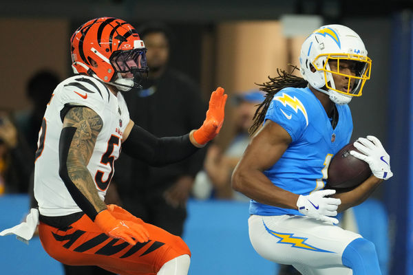 Nov 17, 2024; Inglewood, California, USA; Los Angeles Chargers wide receiver Quentin Johnston (1) is defended by Cincinnati Bengals linebacker Logan Wilson (55) on a 26-yard touchdown reception in the first half at SoFi Stadium. Mandatory Credit: Kirby Lee-Imagn Images