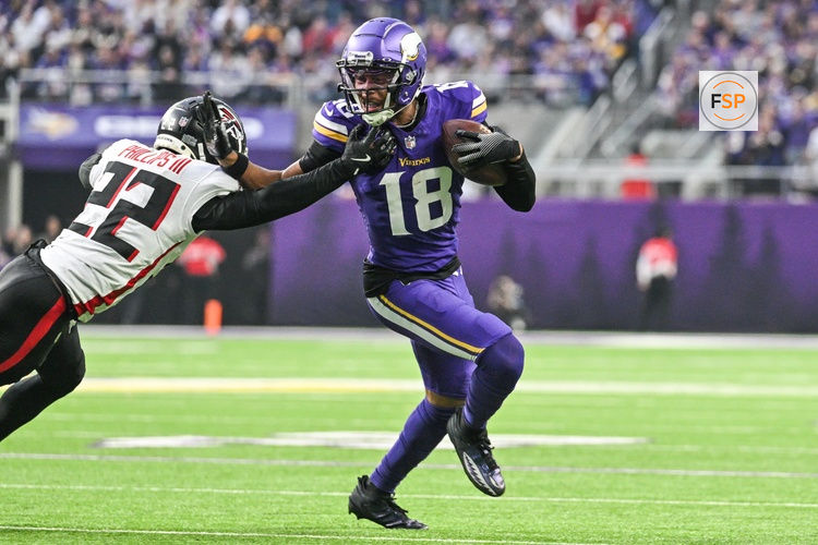 Dec 8, 2024; Minneapolis, Minnesota, USA; Minnesota Vikings wide receiver Justin Jefferson (18) gets yards after the catch as Atlanta Falcons cornerback Clark Phillips III (22) attempts to make the tackle during the fourth quarter at U.S. Bank Stadium. Credit: Jeffrey Becker-Imagn Images