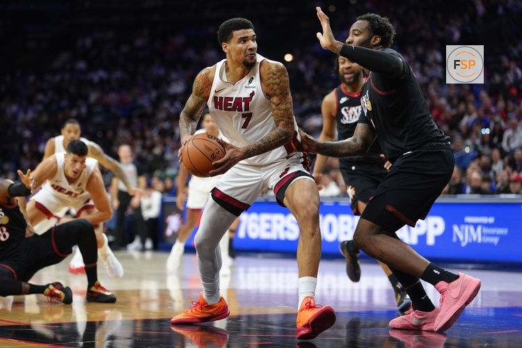 Nov 23, 2025; Philadelphia, Pennsylvania, USA; Miami Heat center Kel’el Ware (7) drives against Philadelphia 76ers center Andre Dummond (1) in the second quarter at Xfinity Mobile Arena. Credit: Kyle Ross-Imagn Images