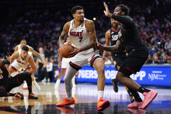 Nov 23, 2025; Philadelphia, Pennsylvania, USA; Miami Heat center Kel’el Ware (7) drives against Philadelphia 76ers center Andre Dummond (1) in the second quarter at Xfinity Mobile Arena. Mandatory Credit: Kyle Ross-Imagn Images