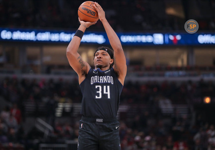 CHICAGO, IL - FEBRUARY 13: Orlando Magic Center Wendell Carter Jr. (34) shoots a 3-point basket during a NBA game between the Orlando  Magic and the Chicago Bulls on February 13, 2023 at the United Center in Chicago, IL. (Photo by Melissa Tamez/Icon Sportswire)
