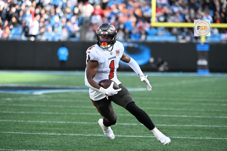 Dec 21, 2025; Charlotte, North Carolina, USA; Tampa Bay Buccaneers running back Rachaad White (1) with the ball in the third quarter at Bank of America Stadium. Credit: Bob Donnan-Imagn Images