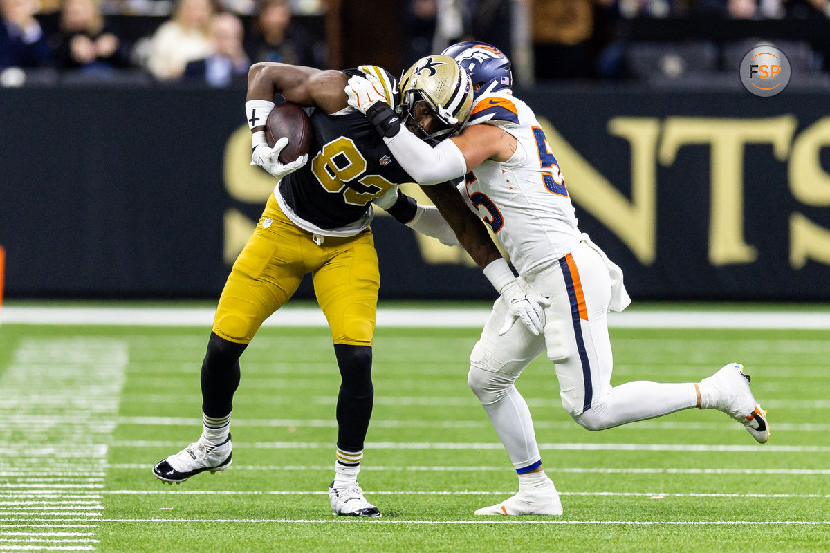 Oct 17, 2024; New Orleans, Louisiana, USA;  Denver Broncos linebacker Cody Barton (55) pushes New Orleans Saints tight end Juwan Johnson (83) out of bounds during the first half at Caesars Superdome. Credit: Stephen Lew-Imagn Images