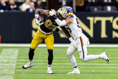 Oct 17, 2024; New Orleans, Louisiana, USA;  Denver Broncos linebacker Cody Barton (55) pushes New Orleans Saints tight end Juwan Johnson (83) out of bounds during the first half at Caesars Superdome. Mandatory Credit: Stephen Lew-Imagn Images