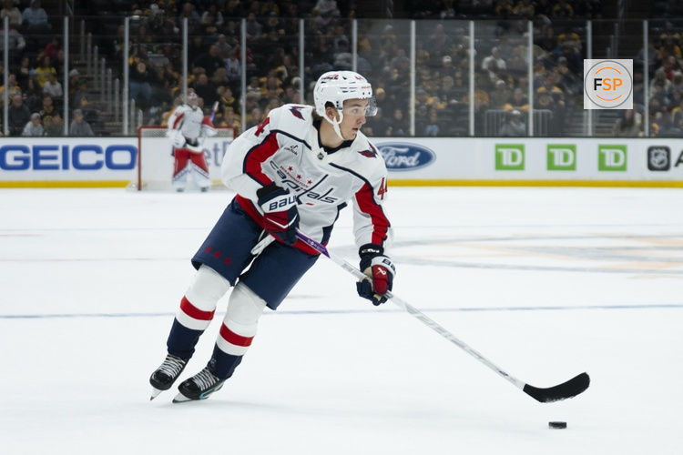 Sep 20, 2026; Boston, Massachusetts, USA;  Washington Capitals defenseman Cole Hutson (44) skates with the puck during the third period of the game against the Boston Bruins at TD Garden.  Credit: Natalie Reid-Imagn Images