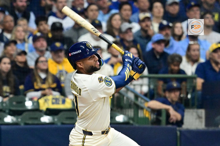 Oct 14, 2025; Milwaukee, Wisconsin, USA; Milwaukee Brewers right fielder Jackson Chourio (11) hits a solo home run against the Los Angeles Dodgers in the first inning during game two of the NLCS round for the 2025 MLB playoffs at American Family Field. Credit: Benny Sieu-Imagn Images