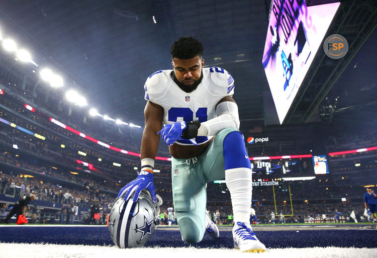 ARLINGTON, TX - DECEMBER 26: Ezekiel Elliott #21 of the Dallas Cowboys takes a knee in the end zone before the Cowboys played the Detroit Lions at AT&T Stadium on December 26, 2016 in Arlington, Texas. (Photo by Tom Pennington/Getty Images)