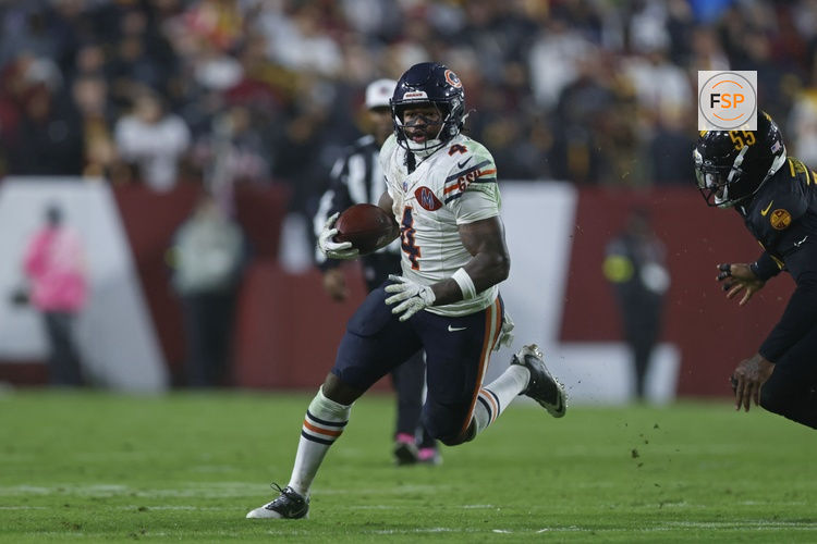 Oct 13, 2025; Landover, Maryland, USA; Chicago Bears running back D'Andre Swift (4) runs with the ball against the Washington Commanders during the fourth quarter at Northwest Stadium. Credit: Peter Casey-Imagn Images