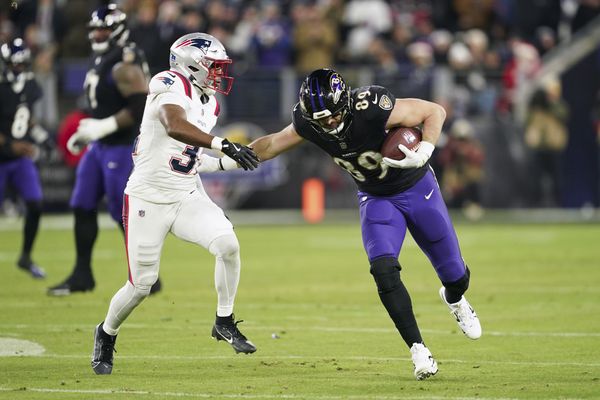 Dec 21, 2025; Baltimore, Maryland, USA;  Baltimore Ravens tight end Mark Andrews (89) runs against New England Patriots safety Craig Woodson (31) during the first half of the game at M&T Bank Stadium. Mandatory Credit: Mitch Stringer-Imagn Images