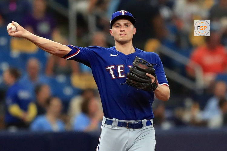 ST. PETERSBURG, FL - OCTOBER 03: Texas Rangers infielder Corey Seager (5) throws the ball over to first base during the American League Wild card game between the Texas Rangers and the Tampa Bay Rays on October 03, 2023, at Tropicana Field in St. Petersburg, FL. (Photo by Cliff Welch/Icon Sportswire)