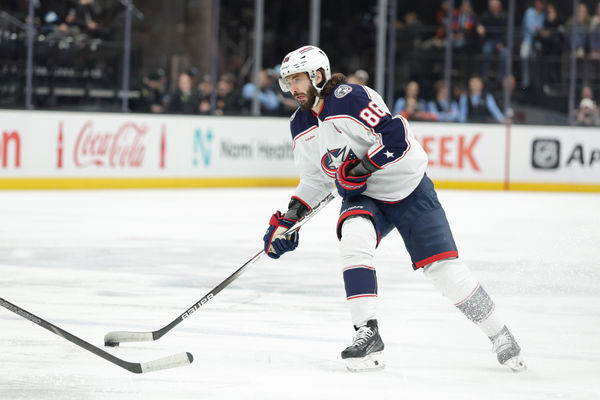 Jan 31, 2025; Salt Lake City, Utah, USA;  Columbus Blue Jackets right wing Kirill Marchenko (86) controls the puck during the first period against the Utah Hockey Club at Delta Center. Mandatory Credit: Chris Nicoll-Imagn Images