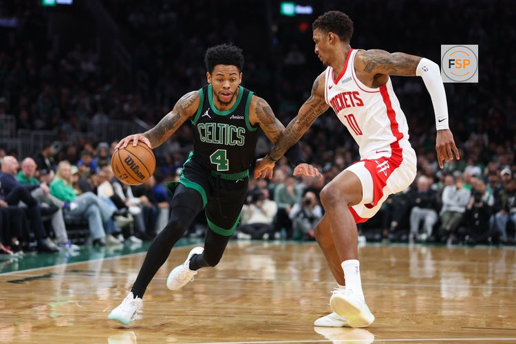 Nov 1, 2025; Boston, Massachusetts, USA; Boston Celtics guard Anfernee Simons (4) drives to the basket during the first half against the Houston Rockets at TD Garden. Credit: Paul Rutherford-Imagn Images
