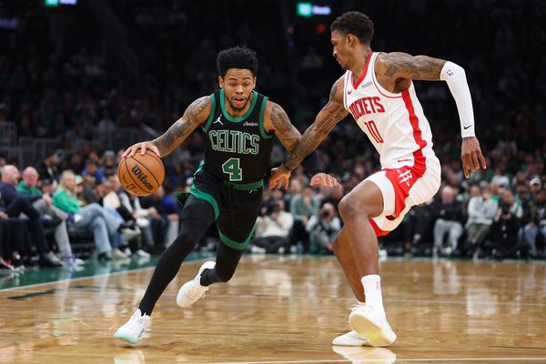 Nov 1, 2025; Boston, Massachusetts, USA; Boston Celtics guard Anfernee Simons (4) drives to the basket during the first half against the Houston Rockets at TD Garden. Mandatory Credit: Paul Rutherford-Imagn Images