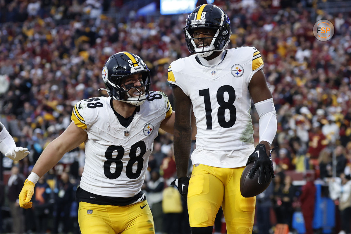 Nov 10, 2024; Landover, Maryland, USA; Pittsburgh Steelers wide receiver Mike Williams (18) celebrates with Steelers tight end Pat Freiermuth (88) after catching a touchdown pass against the Washington Commanders late in the second half at Northwest Stadium. Credit: Geoff Burke-Imagn Images