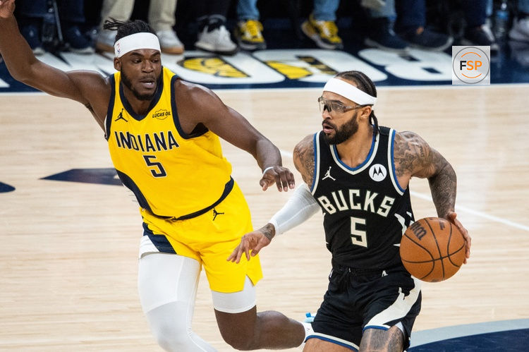 Nov 3, 2025; Indianapolis, Indiana, USA; Milwaukee Bucks guard Gary Trent Jr. (5) dribbles against Indiana Pacers forward Jarace Walker (5) in the first half at Gainbridge Fieldhouse. Credit: Trevor Ruszkowski-Imagn Images