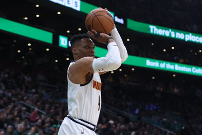 Mar 2, 2025; Boston, Massachusetts, USA;  Denver Nuggets guard Russell Westbrook (4) shoots during the first half against the Boston Celtics at TD Garden. Mandatory Credit: Paul Rutherford-Imagn Images