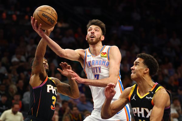 Apr 9, 2025; Phoenix, Arizona, USA; Oklahoma City Thunder forward Chet Holmgren (7) shoots the ball over Phoenix Suns guard Bradley Beal (3) and center Bol Bol (11) during the second half at Footprint Center. Mandatory Credit: Mark J. Rebilas-Imagn Images