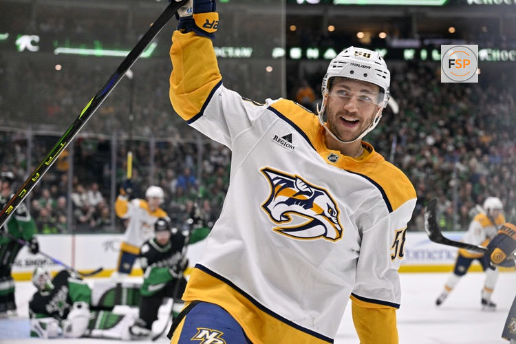 Feb 28, 2026; Dallas, Texas, USA; Nashville Predators left wing Michael Bunting (58) celebrates scoring a power play goal against Dallas Stars goaltender Jake Oettinger (29) during the first period at the American Airlines Center. Credit: Jerome Miron-Imagn Images