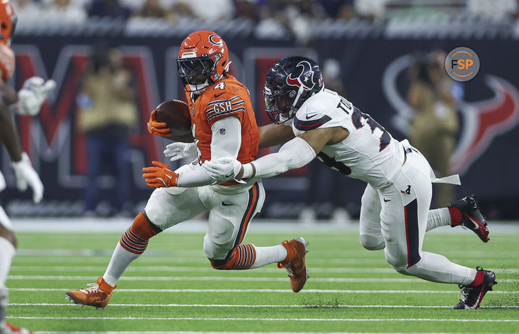 Sep 15, 2024; Houston, Texas, USA; Chicago Bears running back D'Andre Swift (4) runs with the ball as Houston Texans linebacker Henry To'oTo'o (39) attempts to make a tackle during the first quarter at NRG Stadium. Credit: Troy Taormina-Imagn Images