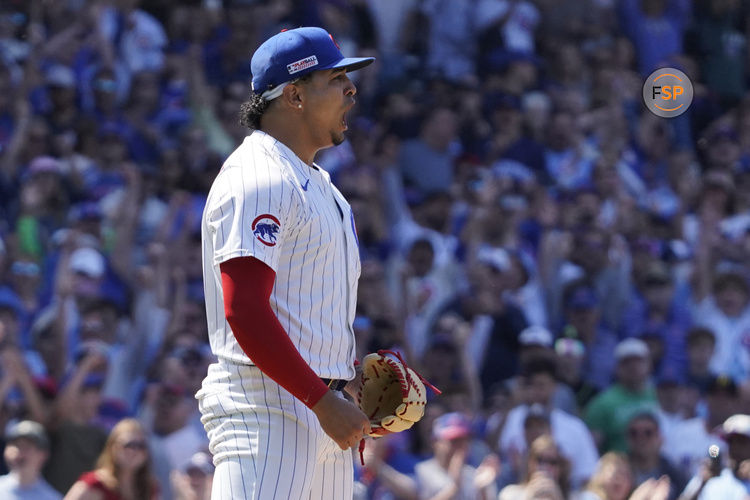 Jun 14, 2025; Chicago, Illinois, USA; Chicago Cubs pitcher Daniel Palencia (48) reacts after getting the final out against the Pittsburgh Pirates during the ninth inning at Wrigley Field. Credit: David Banks-Imagn Images