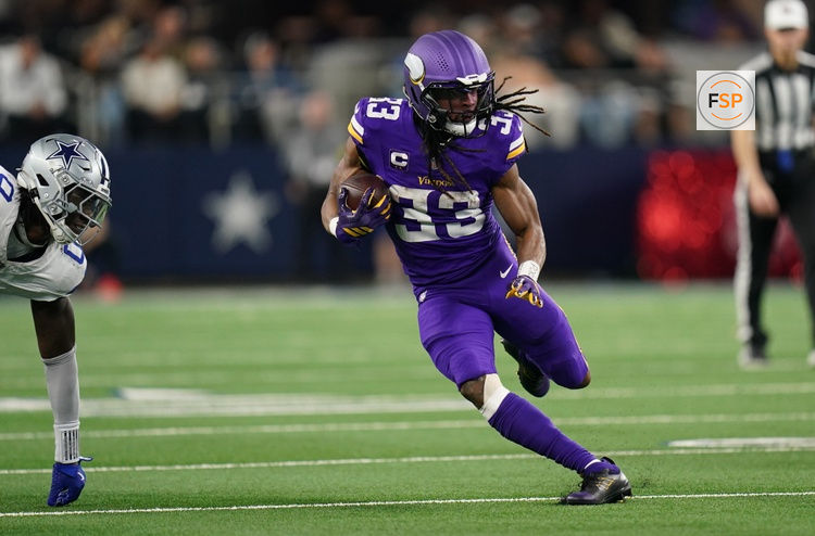 Dec 14, 2025; Arlington, Texas, USA; Minnesota Vikings running back Aaron Jones Sr. (33) runs during the first half against the Dallas Cowboys at AT&T Stadium. Credit: Raymond Carlin III-Imagn Images