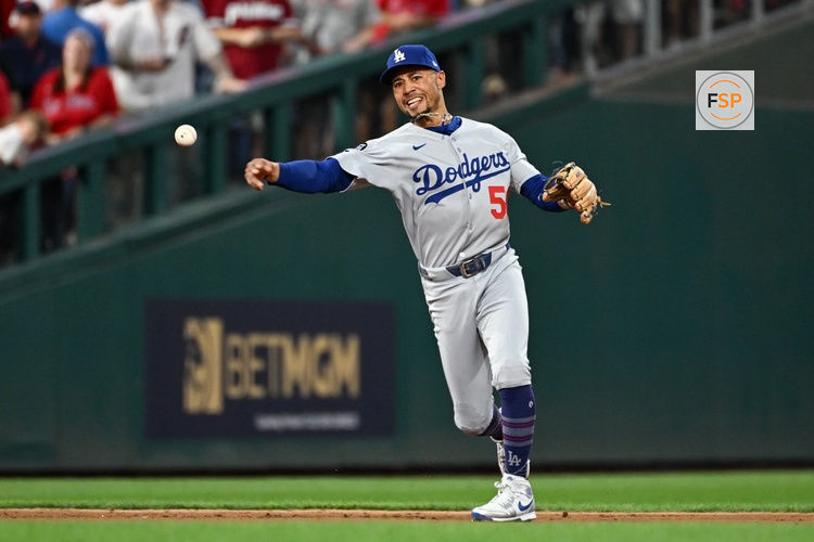 Oct 6, 2025; Philadelphia, Pennsylvania, USA; Los Angeles Dodgers shortstop Mookie Betts (50) makes a play to get out Philadelphia Phillies catcher J.T. Realmuto (not pictured) at first base in the second inning during game two of the NLDS round for the 2025 MLB playoffs at Citizens Bank Park. Credit: Eric Hartline-Imagn Images