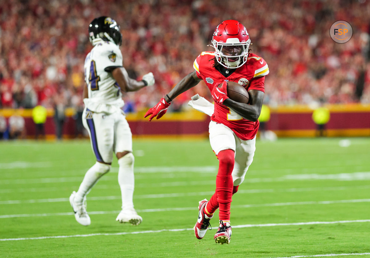 Sep 5, 2024; Kansas City, Missouri, USA; Kansas City Chiefs wide receiver Xavier Worthy (1) scores a touchdown against Baltimore Ravens cornerback Marlon Humphrey (44) during the second half at GEHA Field at Arrowhead Stadium. Credit: Jay Biggerstaff-Imagn Images