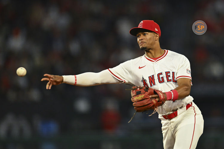 Apr 19, 2025; Anaheim, California, USA; Los Angeles Angels second baseman Kyren Paris (19) fields the ball against the San Francisco Giants during the ninth inning at Angel Stadium. Credit: Jonathan Hui-Imagn Images
