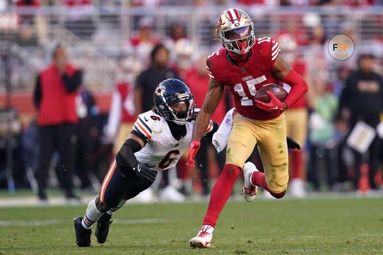 Dec 8, 2024; Santa Clara, California, USA; San Francisco 49ers wide receiver Jauan Jennings (15) runs with the ball after making a catch in front of Chicago Bears cornerback Kyler Gordon (6) in the fourth quarter at Levi's Stadium. Credit: Cary Edmondson-Imagn Images